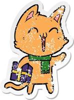distressed sticker of a happy cartoon cat with christmas gift vector