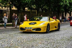 GERMANY, FULDA - JUL 2019 yellow FERRARI F430 Type F131 cabrio is a sports car produced by the Italian automobile manufacturer Ferrari from 2004 to 2009 as a successor to the Ferrari 360. The car is a photo