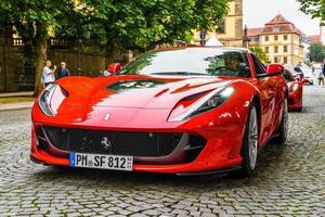 GERMANY, FULDA - JUL 2019 red FERRARI 812 SUPERFAST Type F152M is a front mid-engine, rear-wheel-drive grand tourer produced by Italian sports car manufacturer Ferrari that made its debut at the 2017 photo