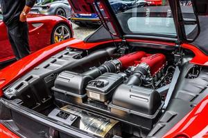 GERMANY, FULDA - JUL 2019 motor of red FERRARI F430 Type F131 cabrio is a sports car produced by the Italian automobile manufacturer Ferrari from 2004 to 2009 as a successor to the Ferrari 360. The ca photo