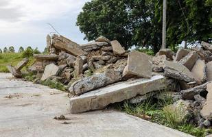 Close-up view of the rubble pile of concrete blocks demolished from the road surface and dumped. photo