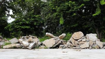 View of the rubble pile of concrete blocks demolished from the road surface and dumped. photo