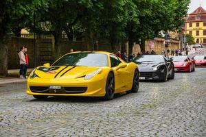 GERMANY, FULDA - JUL 2019 yellow FERRARI 458 SPIDER coupe was introduced at the 2011 Frankfurt Motor Show. This convertible variant of the 458 Italia features an aluminium retractable hardtop which, a photo