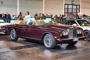 FRIEDRICHSHAFEN - MAY 2019 maroon ROLLS-ROYCE CORNICHE 2 II 1986 cabrio at Motorworld Classics Bodensee on May 11, 2019 in Friedrichshafen, Germany photo