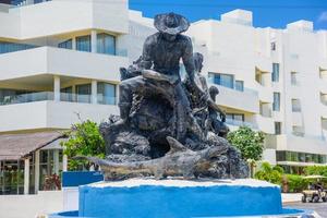 Monument of a fisherman, Al Pescador y Su Familia, Isla Mujeres island, Caribbean Sea, Cancun, Yucatan, Mexico photo