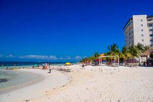 Hotel on the sandy beach on a sunny day in Cancun, Yukatan, Mexico photo