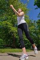 Young beautiful  woman jogging at morning in park photo