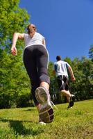 Young couple jogging at morning photo