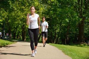 Young couple jogging at morning photo