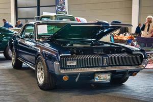 FRIEDRICHSHAFEN - MAY 2019 dark blue MERCURY COUGAR V8 1968 FORD MUSTANG coupe at Motorworld Classics Bodensee on May 11, 2019 in Friedrichshafen, Germany photo