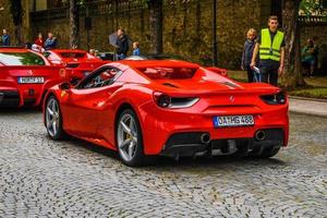 GERMANY, FULDA - JUL 2019 rearview lights of red FERRARI 488 SPIDER Type F142M coupe is a mid-engine sports car produced by the Italian automobile manufacturer Ferrari. The car is an update to the 458 photo