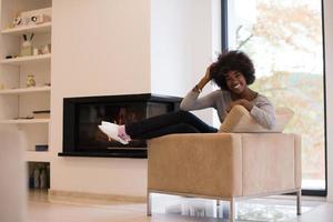 black woman in front of fireplace photo