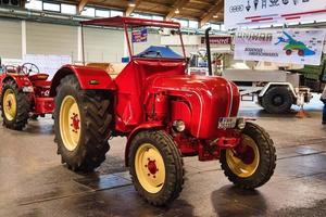 FRIEDRICHSHAFEN - MAY 2019 red PORSCHE JUNIOR DIESEL SUPER TRACTOR 1960 at Motorworld Classics Bodensee on May 11, 2019 in Friedrichshafen, Germany photo