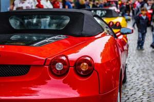 GERMANY, FULDA - JUL 2019 red FERRARI F430 Type F131 cabrio is a sports car produced by the Italian automobile manufacturer Ferrari from 2004 to 2009 as a successor to the Ferrari 360. The car is an u photo