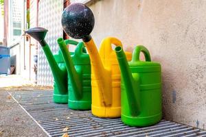 four garden watering cans photo