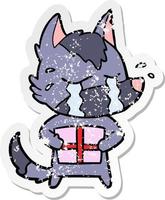 distressed sticker of a cartoon crying wolf with christmas present vector