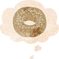 donut de dibujos animados y burbuja de pensamiento en estilo retro texturizado vector