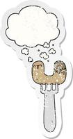 cartoon sausage on fork and thought bubble as a distressed worn sticker vector