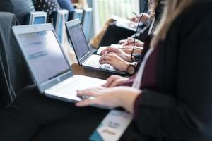 close up of business people hands using laptop computer photo