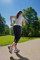 Young beautiful  woman jogging photo