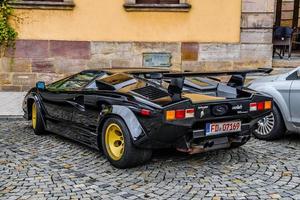 GERMANY, FULDA - JUL 2019 black LAMBORGHINI COUNTACH is a rear mid-engine, rear-wheel-drive sports car produced by the Italian automobile manufacturer Lamborghini from 1974 to 1990. It is one of the t photo