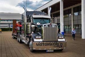 FRIEDRICHSHAFEN - MAY 2019 black KENWORTH W900 1961 conventional-cab truck at Motorworld Classics Bodensee on May 11, 2019 in Friedrichshafen, Germany photo