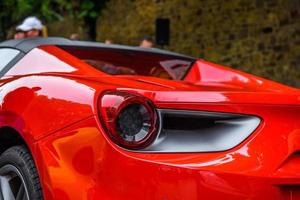 GERMANY, FULDA - JUL 2019 rearview lights of red FERRARI 488 SPIDER Type F142M coupe is a mid-engine sports car produced by the Italian automobile manufacturer Ferrari. The car is an update to the 458 photo