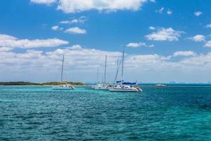 Sailboat and turquoise clear water, blue water, Caribbean ocean, Isla Mujeres, Cancun, Yucatan, Mexico photo