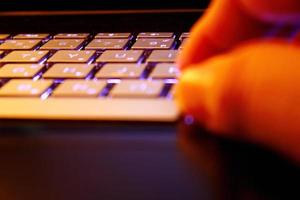 man using laptop, searching web, browsing information, having workplace at home, soft focus picture, Vintage concept, night photo