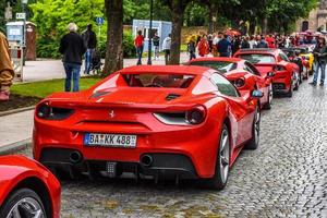 GERMANY, FULDA - JUL 2019 rearview lights of red FERRARI 488 SPIDER Type F142M coupe is a mid-engine sports car produced by the Italian automobile manufacturer Ferrari. The car is an update to the 458 photo