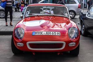 GERMANY, LIMBURG - APR 2017 red vintage ALFA ROMEO SPIDER in Limburg an der Lahn, Hesse, Germany photo