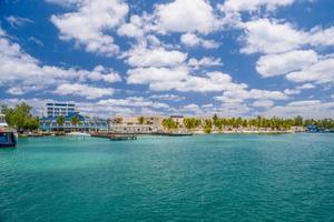 Port with sailboats and ships in Isla Mujeres island in Caribbean Sea, Cancun, Yucatan, Mexico photo