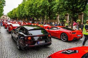 GERMANY, FULDA - JUL 2019 black FERRARI F12 BERLINETTA coupe also unofficially referred to as the F12 Berlinetta or the F12, and unofficially stylized as the F12B for short Type F152 is a front mid-en photo