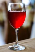 Glass of colorful fresh red cranberry juice close-up in the Restaurant
