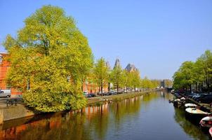 Beautiful river with boats in Amsterdam, Holland Netherlands photo