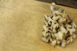 Ginger on wood plate for food content. photo