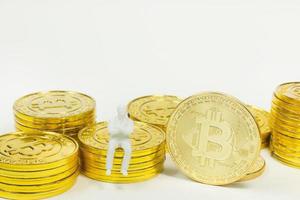 white miniature and gold coin bitcoin abstract image close up background. photo