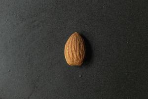The Almond on black Ceramic Plate close up image. photo