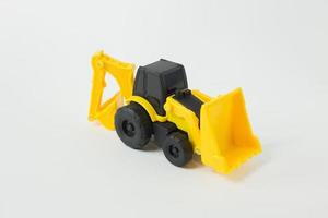 Yellow Tractor Loader Toy on white background isolation image. photo