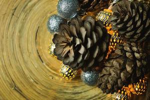 christmas ball and Pine cones  on wood  background. photo