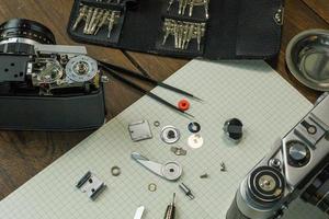 The vintage camera film service, adjustment and alignment. Camera lens repair photo