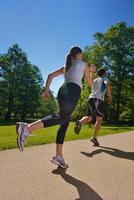 Young couple jogging at morning photo