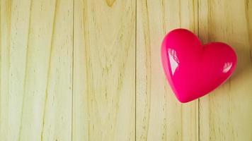 pink heart on wood table for Health and medical content. photo