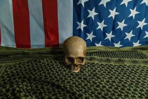 The  united states of America flag and Shemagh  and skull abstract background. photo