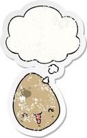 cartoon egg and thought bubble as a distressed worn sticker vector