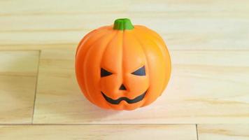 jack o lantern toy on  wood table for holiday content. photo