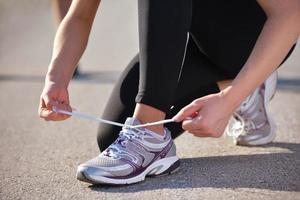 Couple doing stretching exercise  after jogging photo
