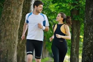 Young couple jogging at morning photo