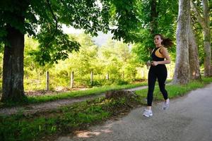 Young beautiful  woman jogging photo