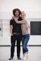 couple hugging in their new home photo